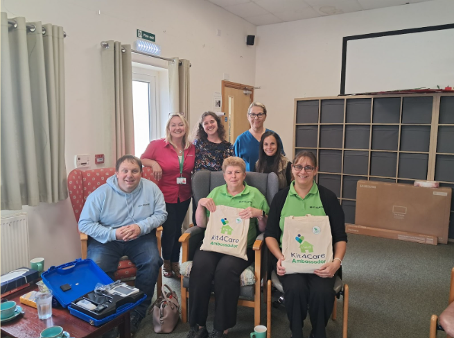 Team receiving Kit4Care goody bags